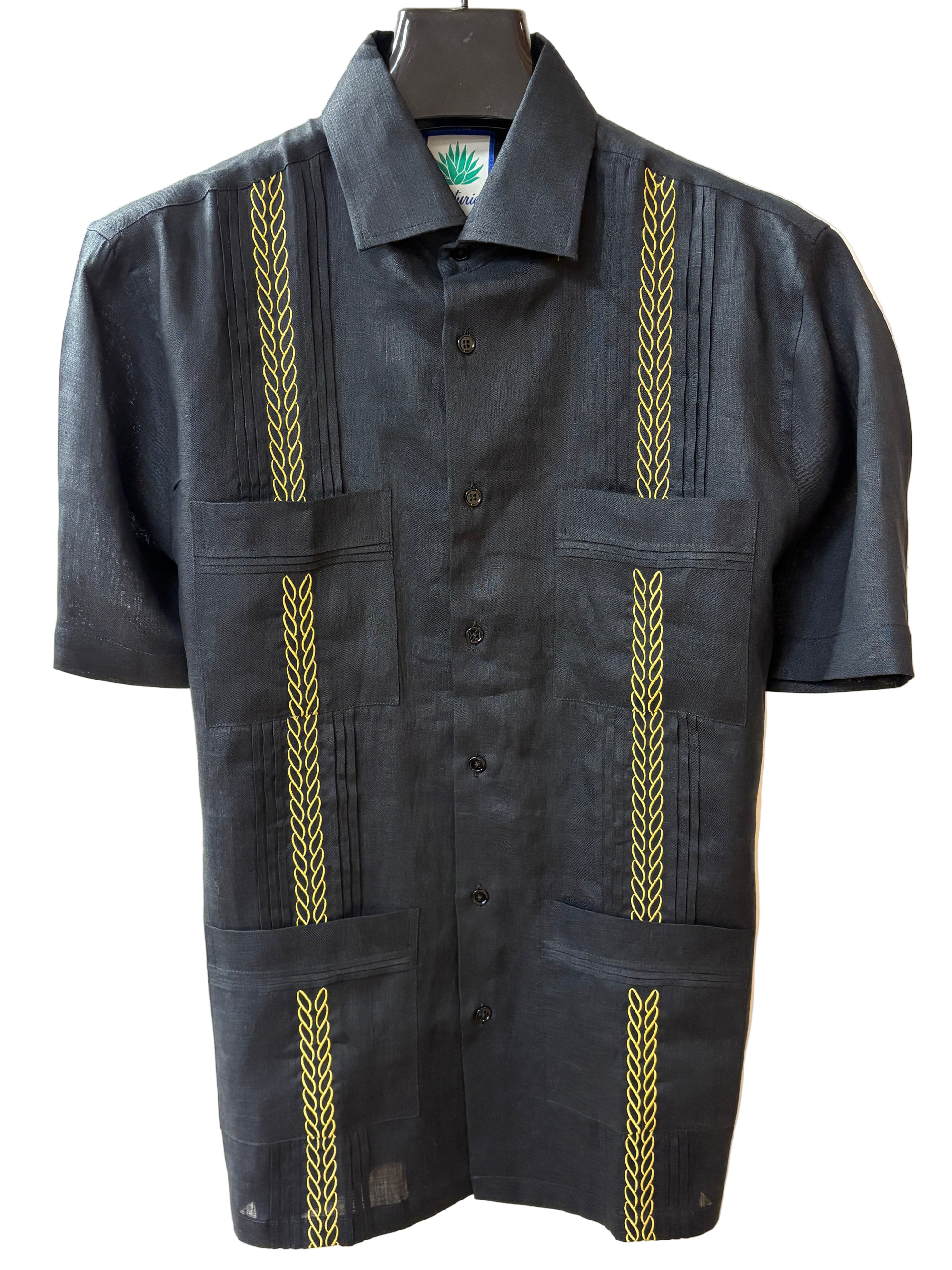 Soft linen guayabera with a black base and a beautiful gold embroidery! You'll love our newest and nicest guayabera that we carry!