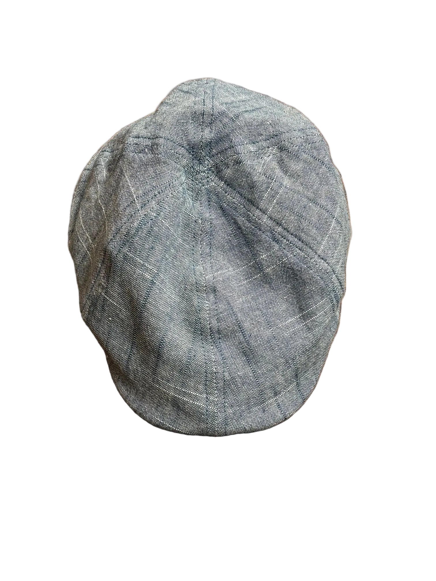 Gray checkered cap on a wooden surface