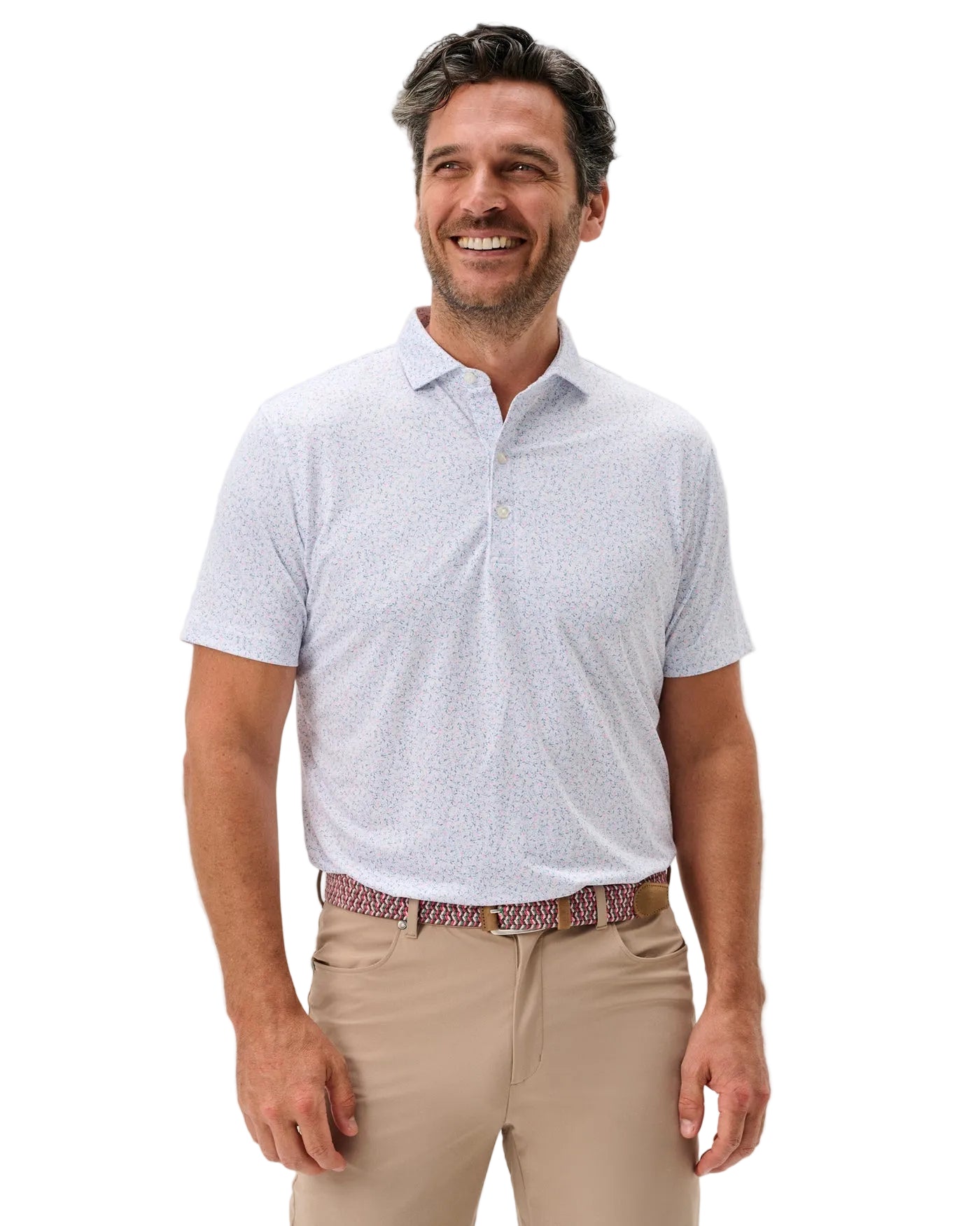 Man wearing a light gray patterned polo shirt and beige pants on a white background