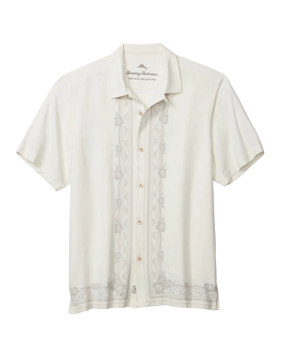 An off-white short-sleeve button-up shirt by Tommy Hilfiger, featuring vertical floral embroidery on the front and a small embroidered logo on the inner neck label, displayed against a clean white background.